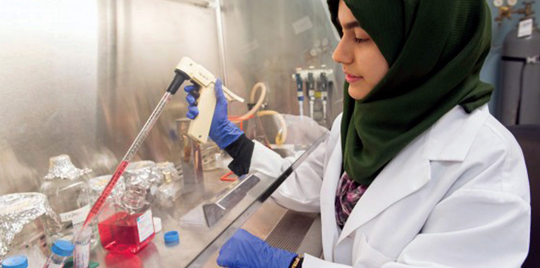 Muslim student in chemistry lab
