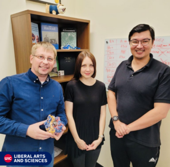 Yuri Polikanov, Ego Syroegin, Elena Aleksandrova standing in classroom 