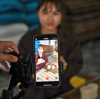 A mobile phone being used to shoot a TikTok video. PHOTO: AFP 
