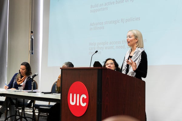 UIC Alumni speaking at event