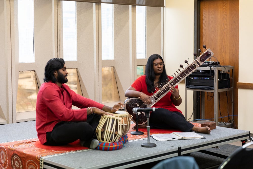 Students playing instruments at Global Asian Studies event