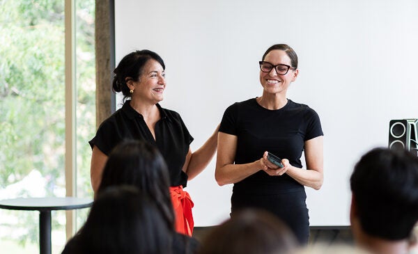 Rosie Hernandez and Marisol Mastrangelo presenting at event