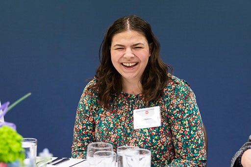 French student laughing at Scholarship Luncheon