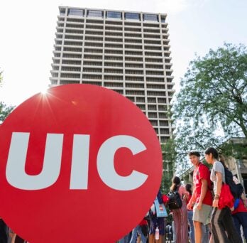 uic students walking in front of UH bldg 