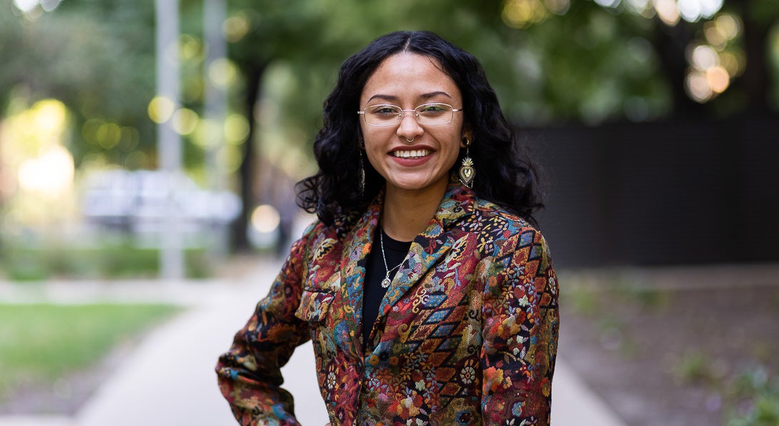 English student Dazalyn Moreno wears wire rimmed glasses and colorful blazer